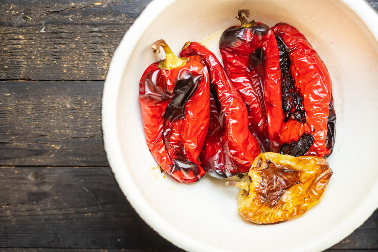 Roasted bell peppers in air fryer, slightly charred and colorful.