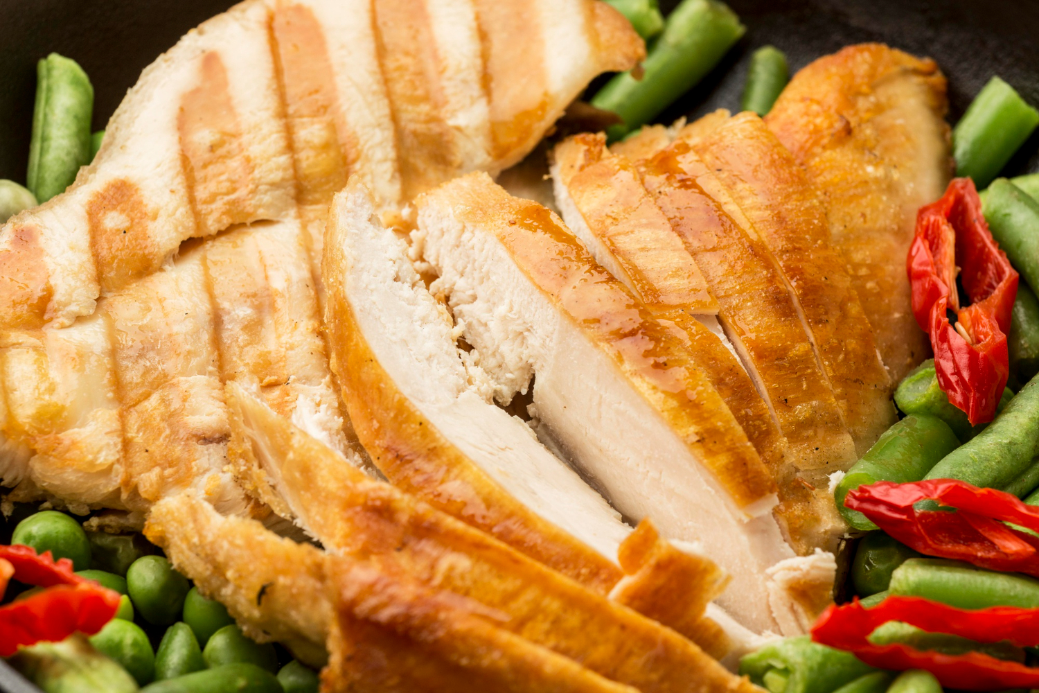 Juicy chicken breast in air fryer with a crispy golden-brown exterior