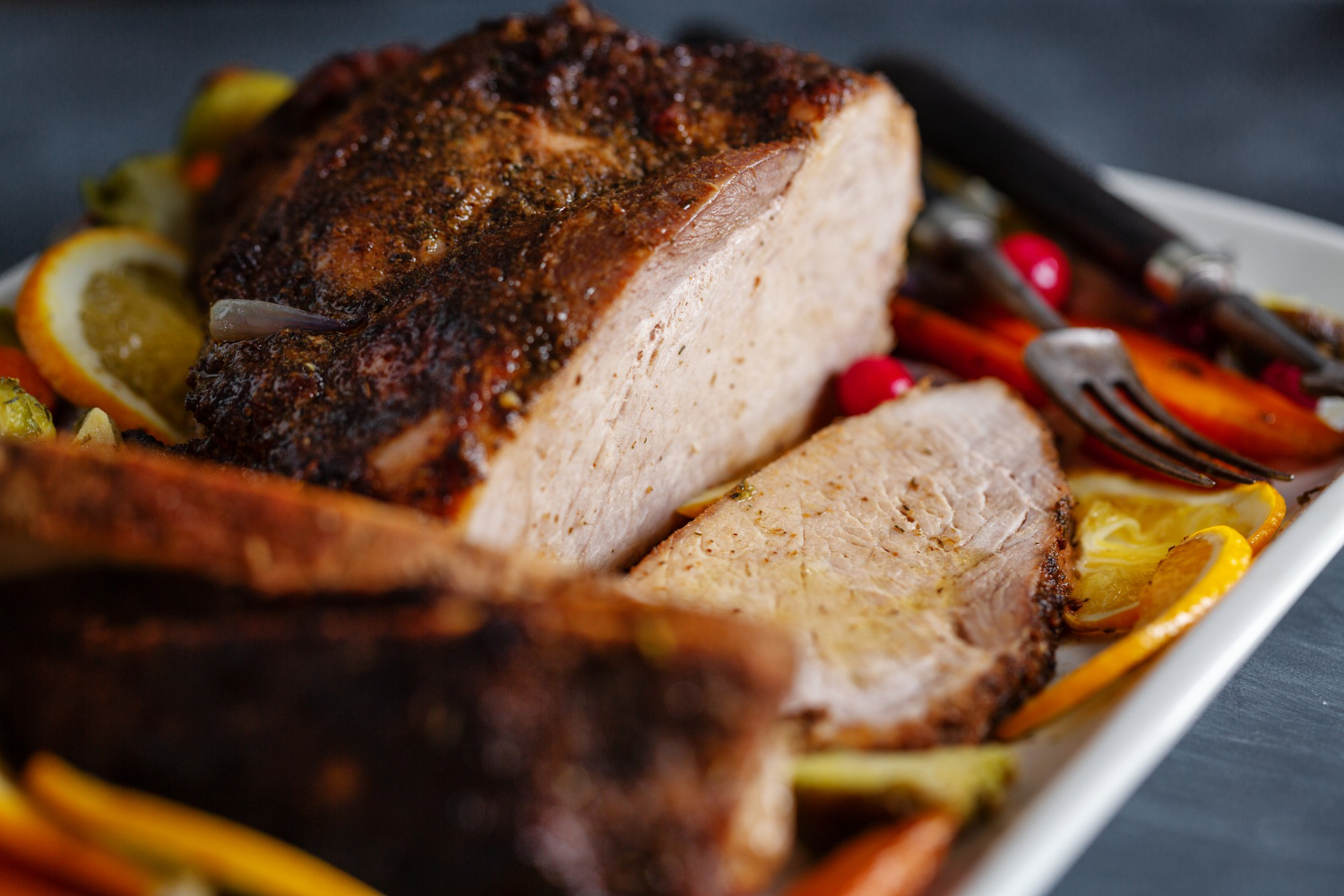 Cooked ham in air fryer with a caramelized glaze.