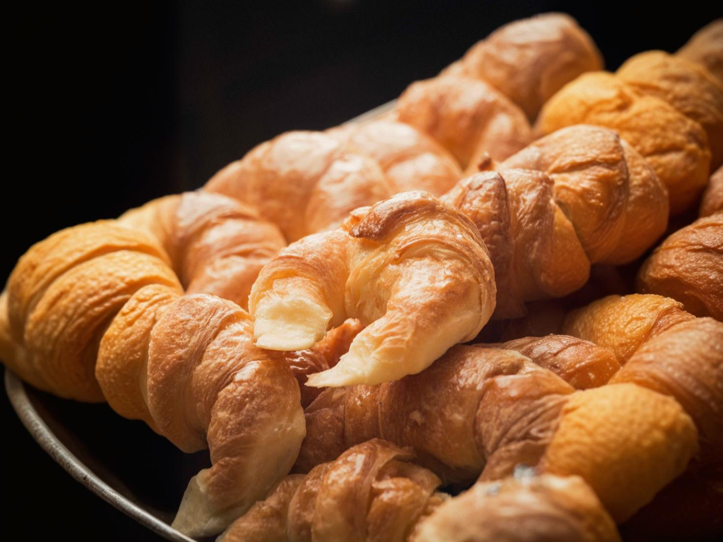 Golden croissants in air fryer basket