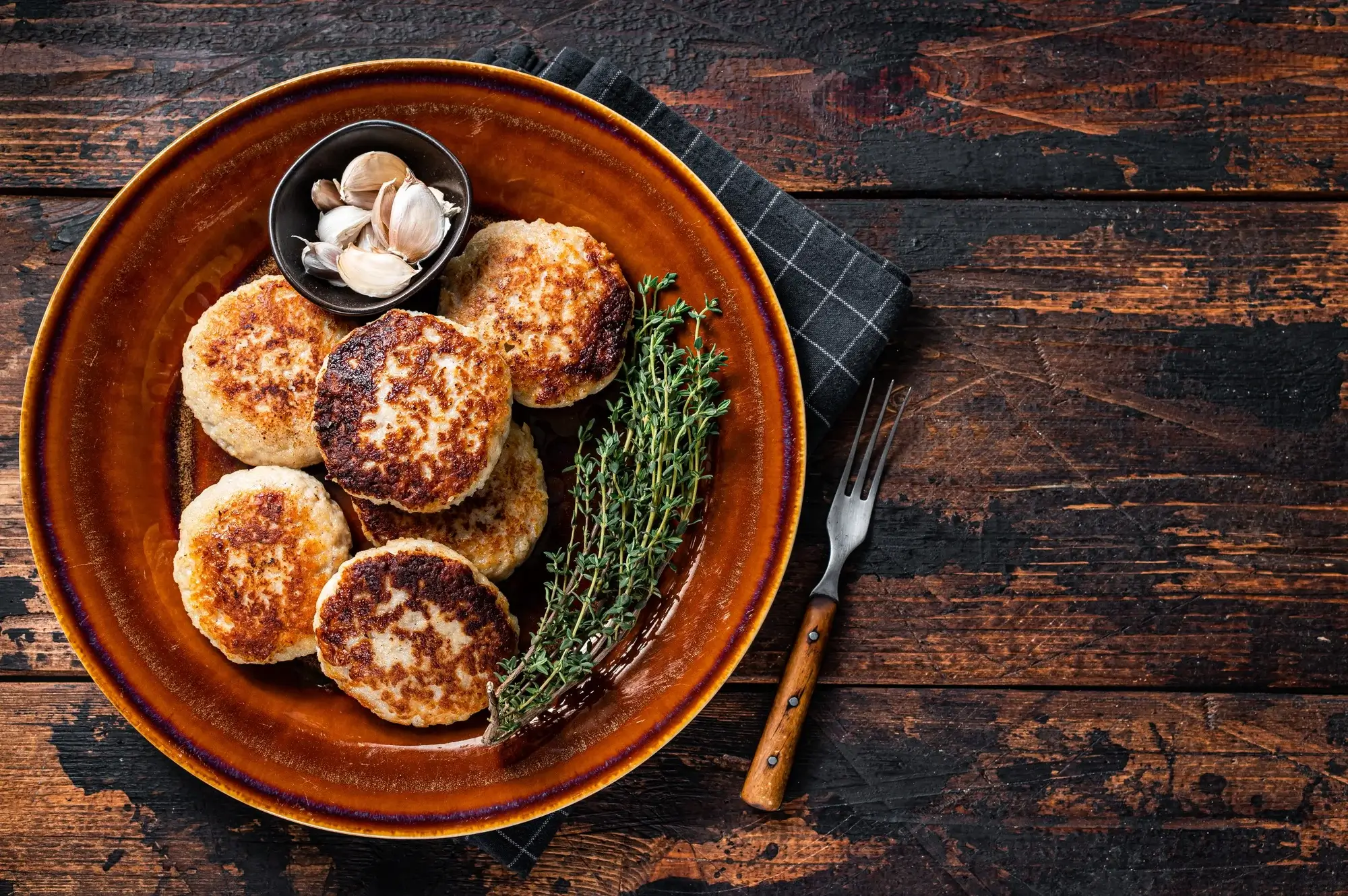 Juicy pork patties in air fryer, golden brown and cooked to perfection.