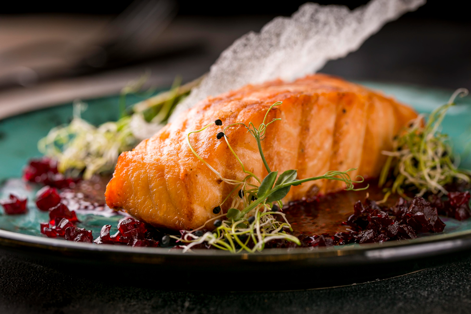 Salmon in air fryer cooked to perfection with a crispy crust.