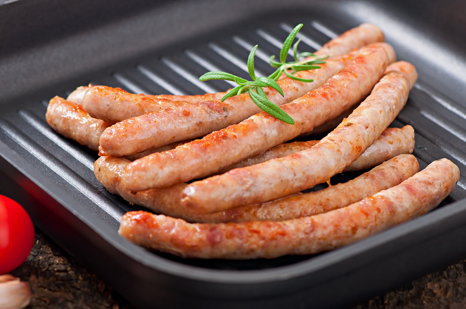 Crispy sausage in air fryer with golden brown texture.