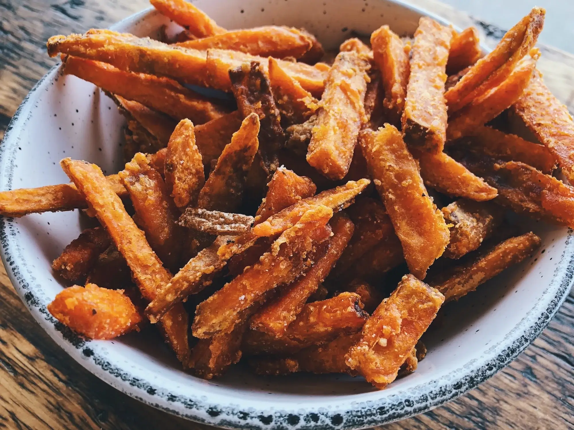 Crispy sweet potato fries in air fryer, golden brown and perfectly roasted.